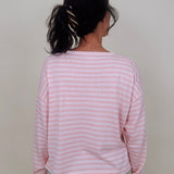 Kingston Striped Sweater in blush pink and ivory stripes with a relaxed drop shoulder, boxy body, and long sleeves in a lightweight knit.