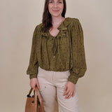 Kortni Blouse in martini olive with tonal brown polka dots, a ruffle collar, tie front V neckline, and balloon sleeves