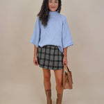 Long Island Sweater in powder blue with a folded ribbed mock neck, wide bell sleeves, and a relaxed boxy cotton knit body
