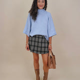 Long Island Sweater in powder blue with a folded ribbed mock neck, wide bell sleeves, and a relaxed boxy cotton knit body