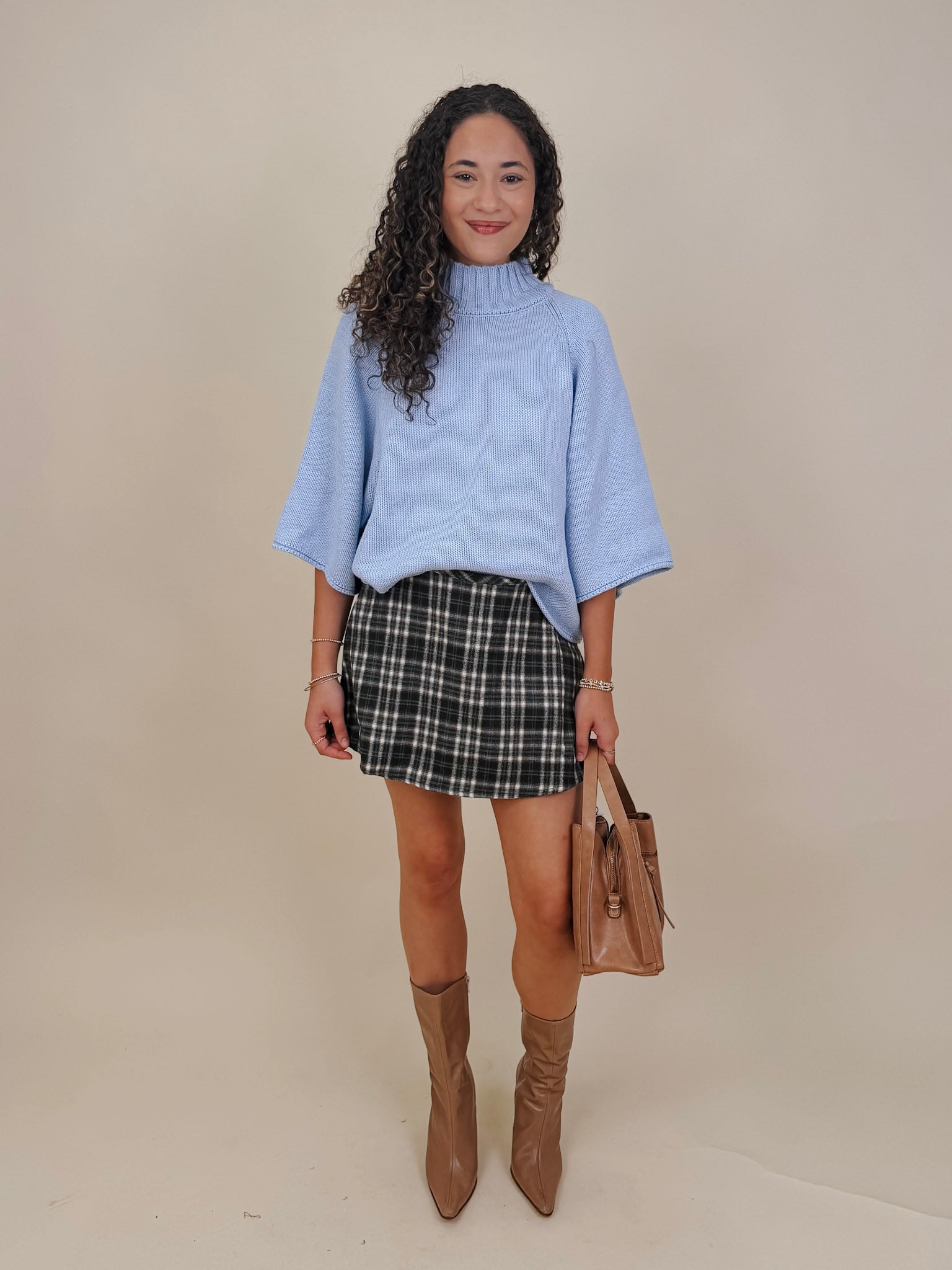 Long Island Sweater in powder blue with a folded ribbed mock neck, wide bell sleeves, and a relaxed boxy cotton knit body