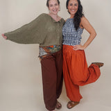 Magazine Street Pant in rust cotton with a smocked drawstring waist, gathered yoke, side pockets, and a full balloon leg
