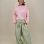 Magazine Street Pant in light olive cotton with a smocked drawstring waist, gathered yoke, side pockets, and a full balloon leg