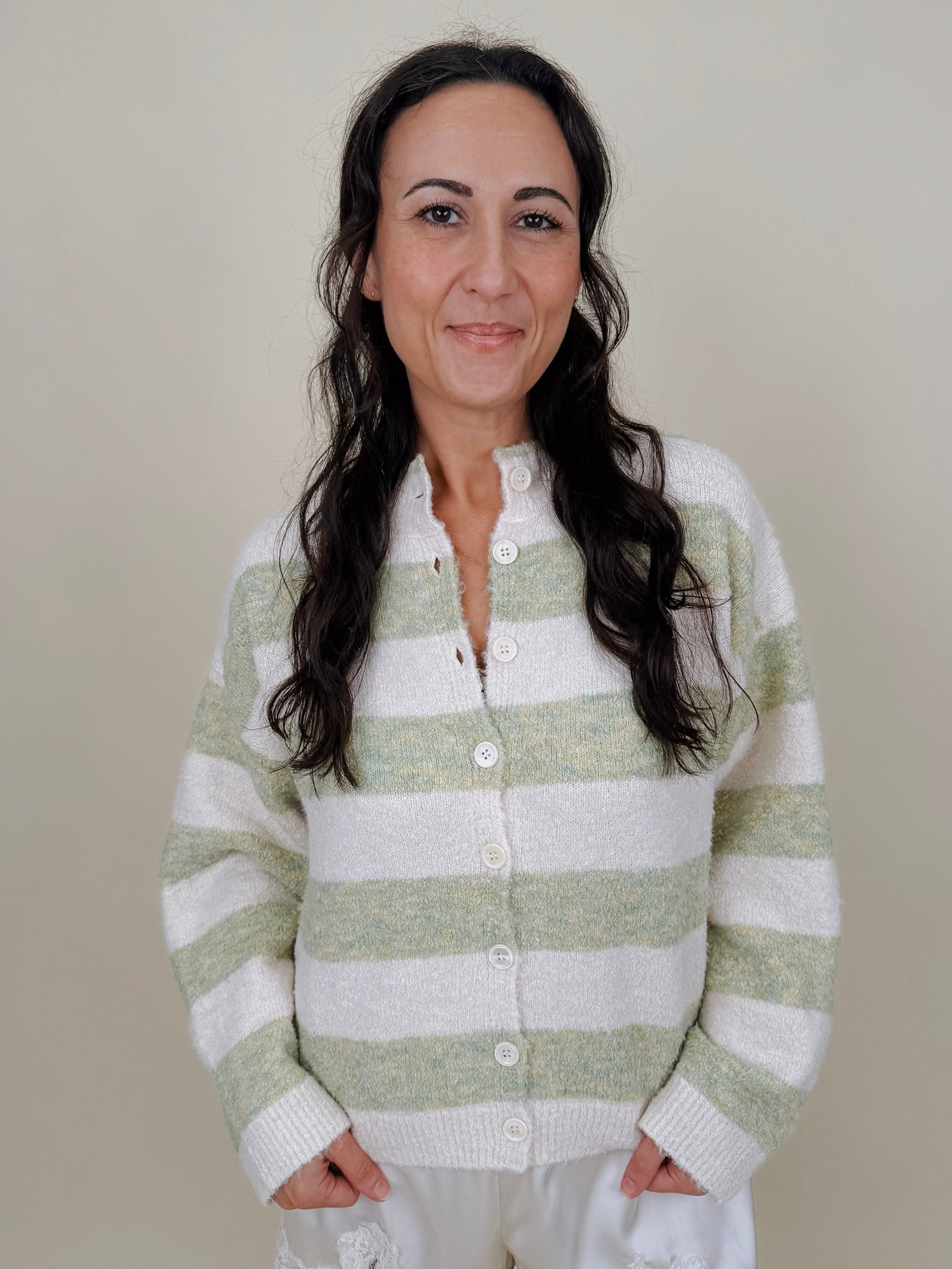 Melanie Striped Cardigan in sage green and cream stripes with a white button front, ribbed cuffs, and a slightly cropped brushed knit body