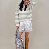 Melanie Striped Cardigan in sage green and cream stripes with a white button front, ribbed cuffs, and a slightly cropped brushed knit body