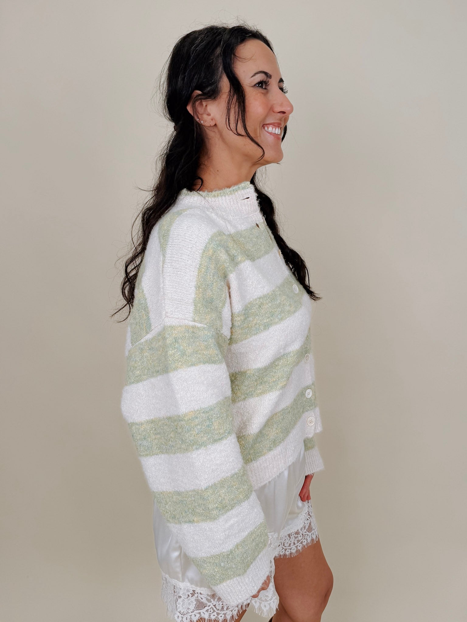 Melanie Striped Cardigan in sage green and cream stripes with a white button front, ribbed cuffs, and a slightly cropped brushed knit body