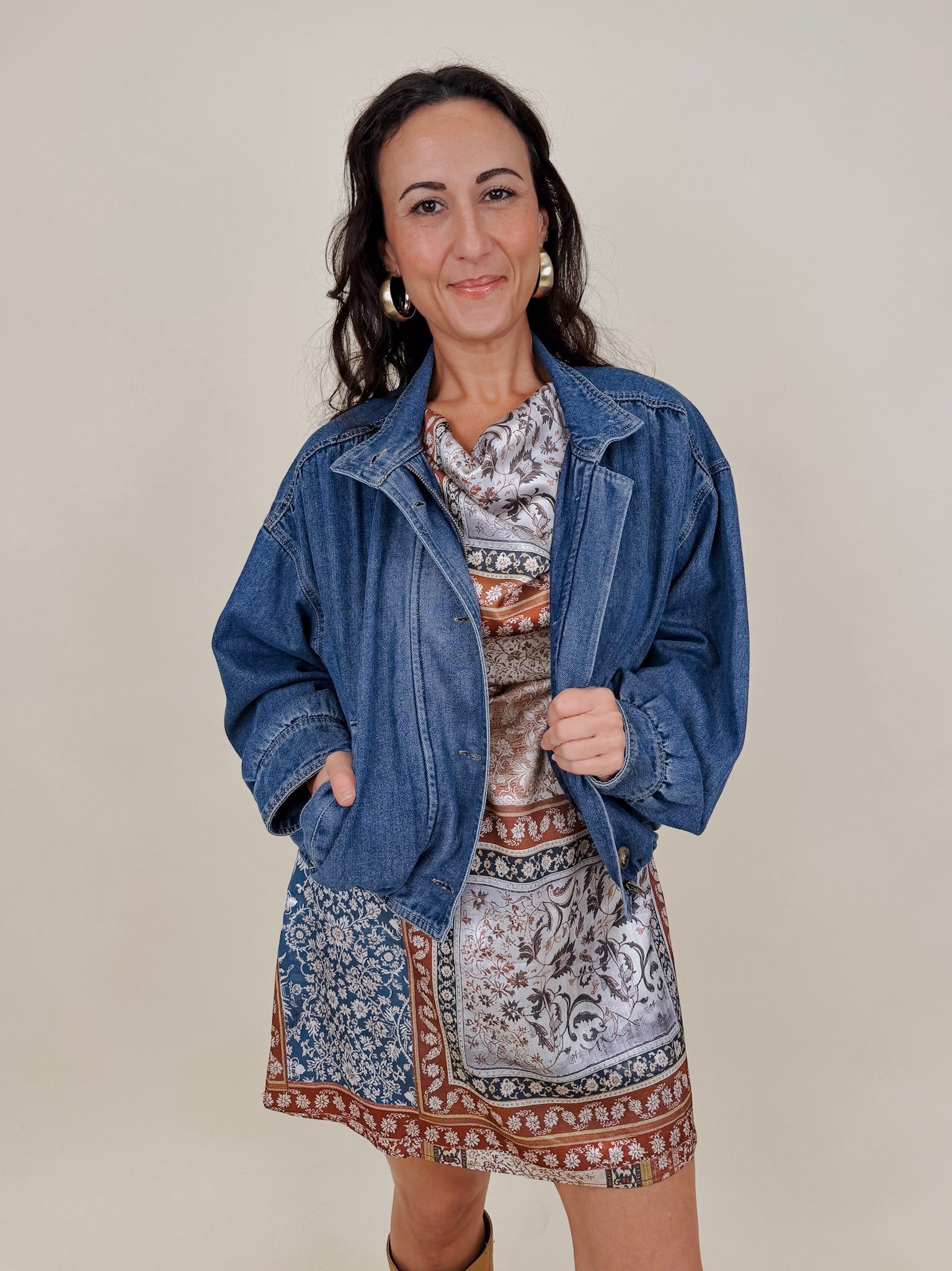 Pumpkin Patch Denim Jacket in medium wash denim with tortoise buttons over a hidden zip front, gathered shoulders, welt pockets, and an elastic bubble hem