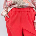 Summer Day Pant in bold red cotton with elastic waistband, side pockets, and wide leg silhouette