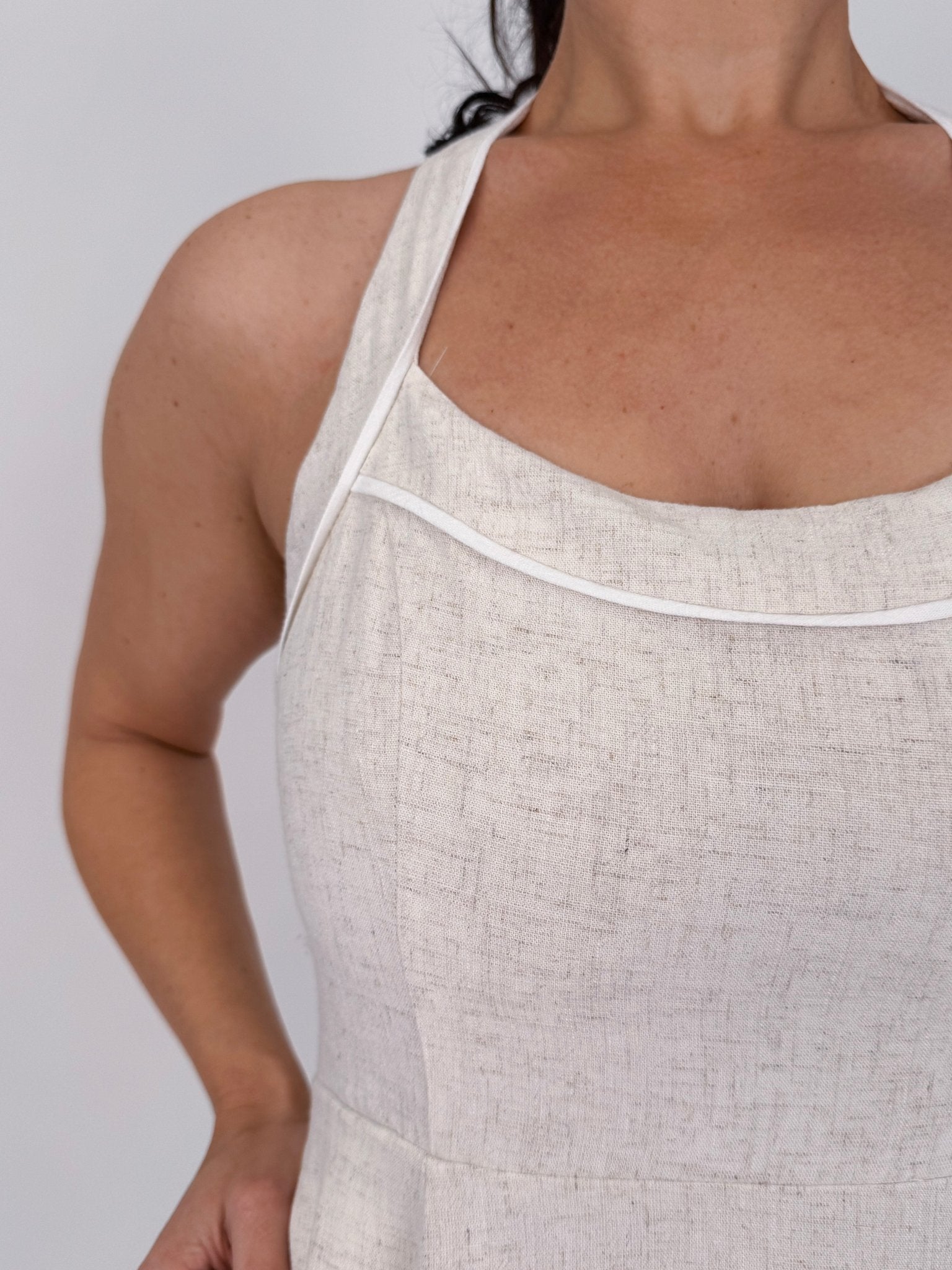 Crazy In Love Halter Neck Dress in natural oatmeal linen blend with halter neckline, fitted bodice, and flowy A line midi skirt