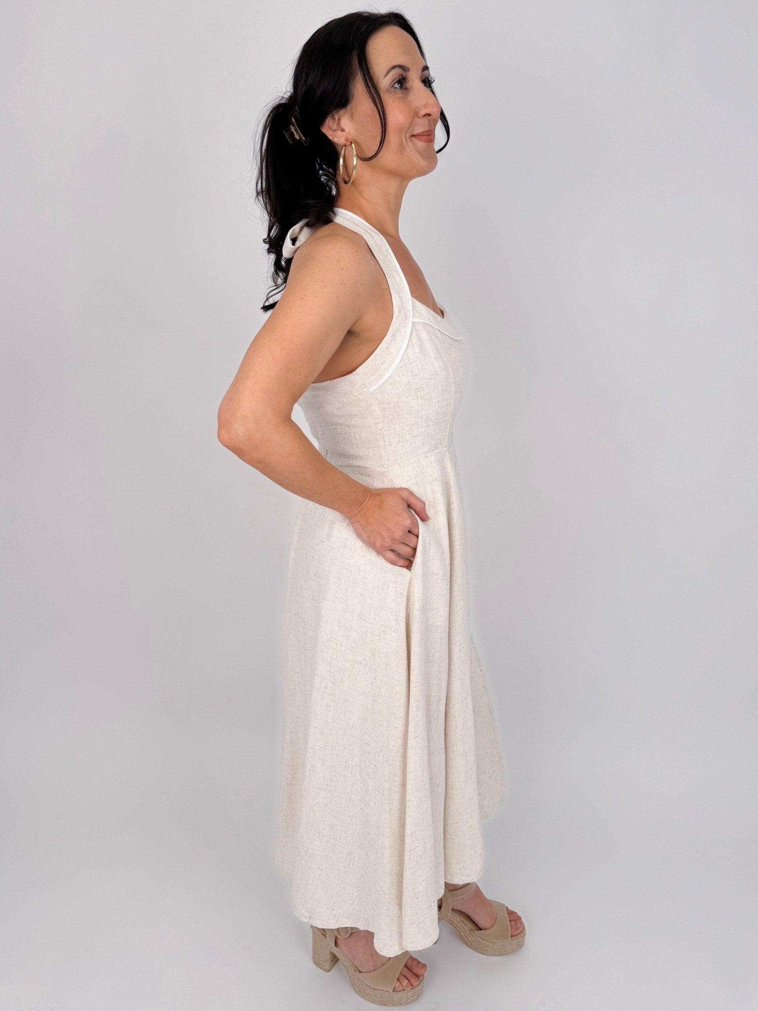 Crazy In Love Halter Neck Dress in natural oatmeal linen blend with halter neckline, fitted bodice, and flowy A line midi skirt
