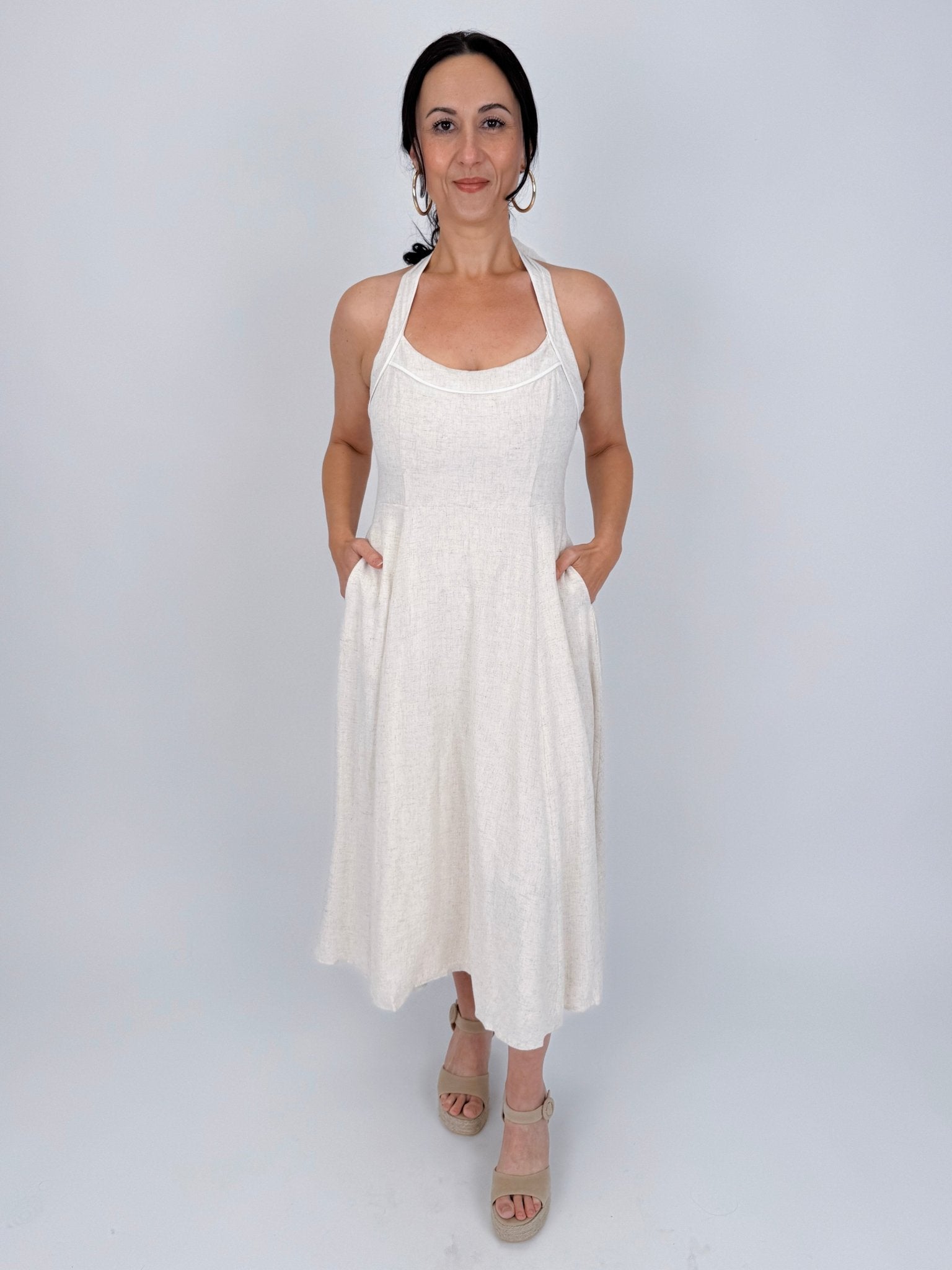 Crazy In Love Halter Neck Dress in natural oatmeal linen blend with halter neckline, fitted bodice, and flowy A line midi skirt
