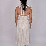 Crazy In Love Halter Neck Dress in natural oatmeal linen blend with halter neckline, fitted bodice, and flowy A line midi skirt