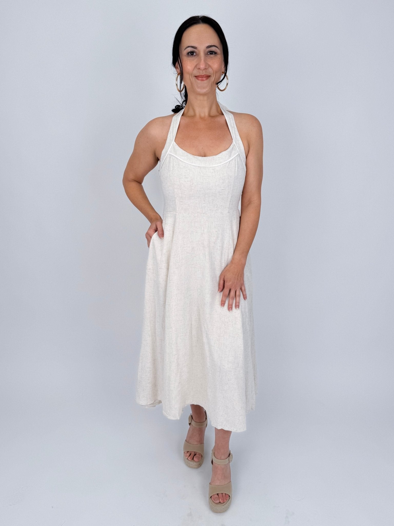 Crazy In Love Halter Neck Dress in natural oatmeal linen blend with halter neckline, fitted bodice, and flowy A line midi skirt