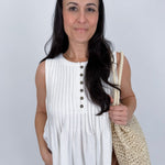 Betsey Pleated Blouse in mocha and off white with vertical pleated front, antique button detail, and raw frayed hem