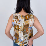Jenny Lee Mixed Print Blouse in golden amber patchwork floral print with high round neckline and sleeveless silhouette