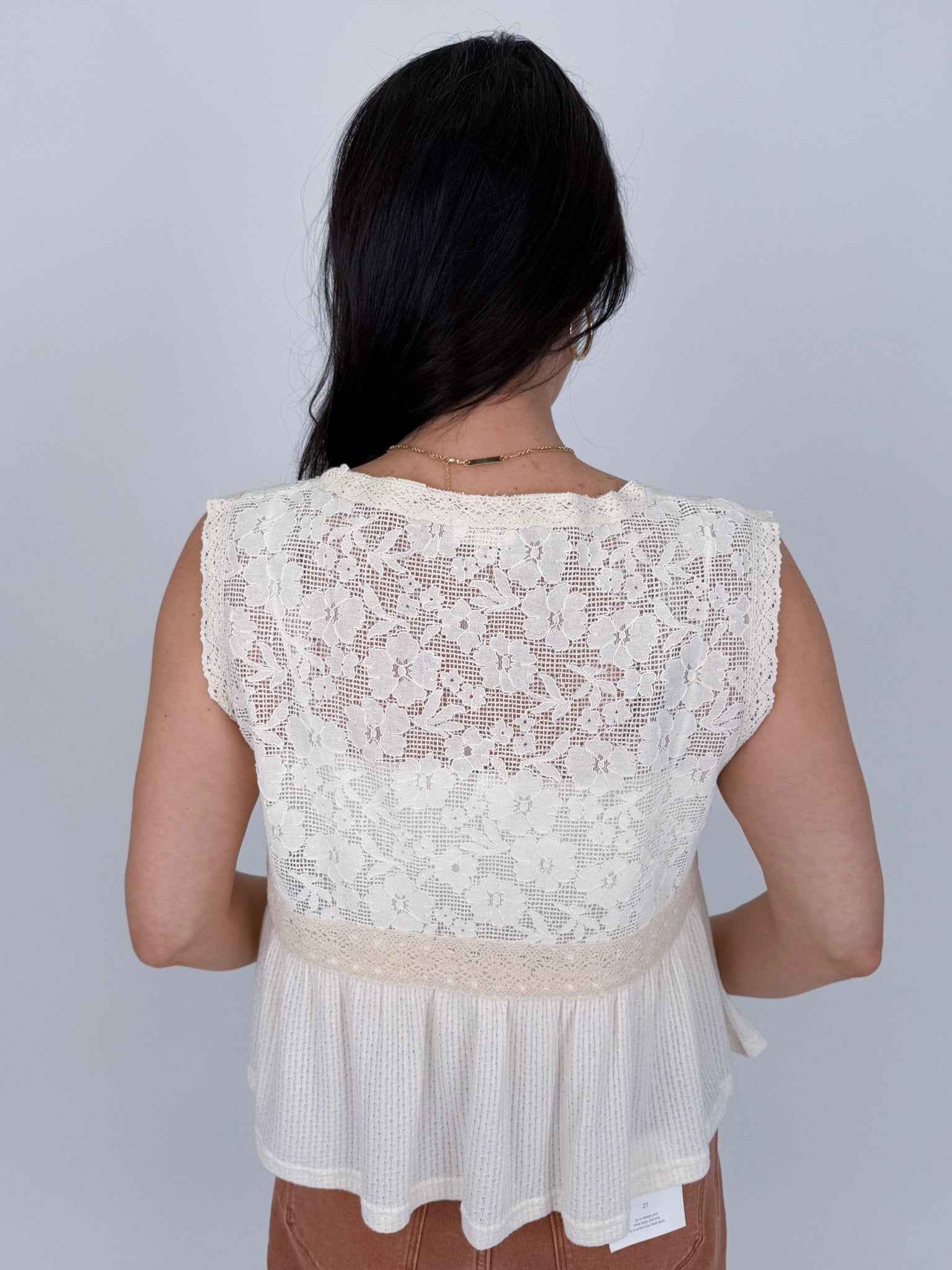 If You Wish Lace Detail Blouse in ivory with lace overlay bodice, tie front sweetheart neckline, crochet waist trim, and ribbed peplum hem