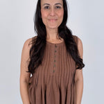 Betsey Pleated Blouse in mocha and off white with vertical pleated front, antique button detail, and raw frayed hem
