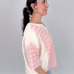 To See You Smile Stripe Top in pink multi stripe with ivory contrast panels, notch neckline, and relaxed boxy fit