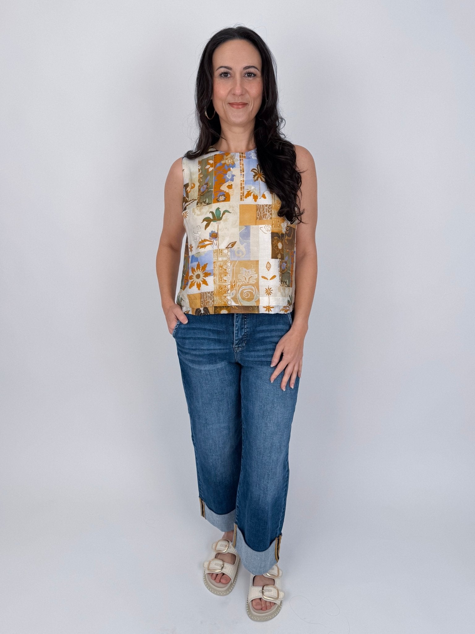Jenny Lee Mixed Print Blouse in golden amber patchwork floral print with high round neckline and sleeveless silhouette