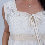 If You Wish Lace Detail Blouse in ivory with lace overlay bodice, tie front sweetheart neckline, crochet waist trim, and ribbed peplum hem