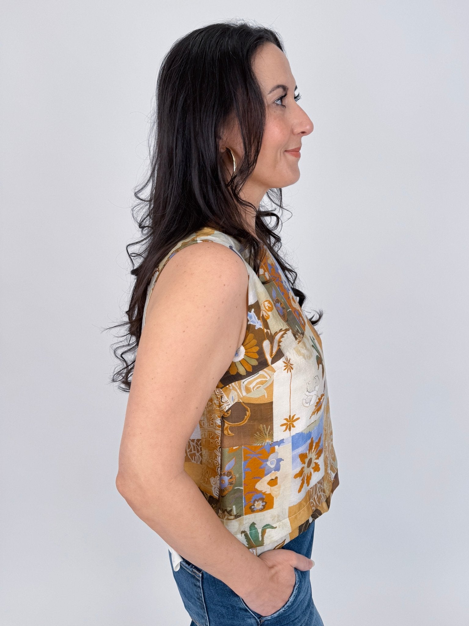 Jenny Lee Mixed Print Blouse in golden amber patchwork floral print with high round neckline and sleeveless silhouette
