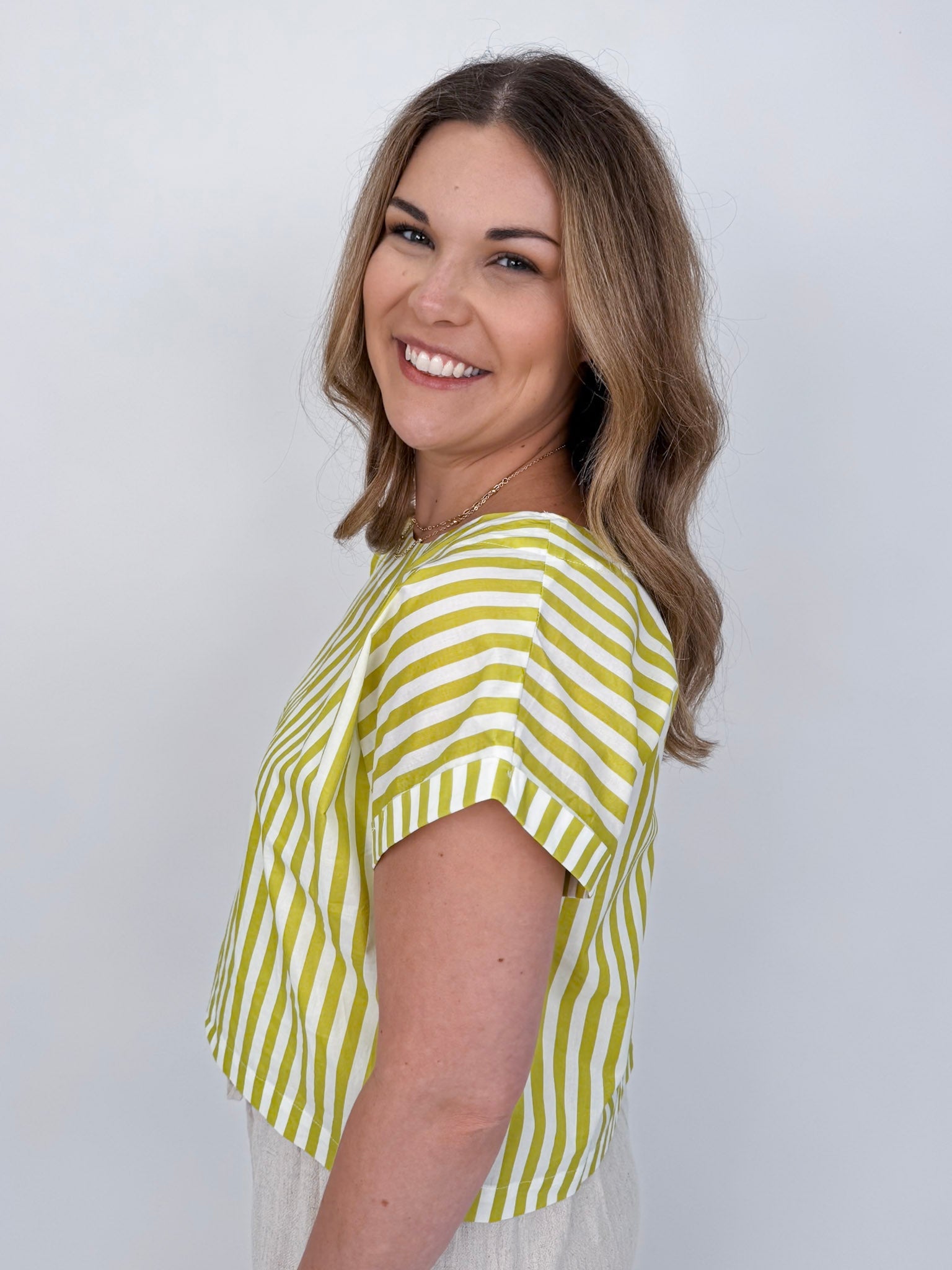 Missy Striped Top in lime green and white stripe with flutter sleeves and button-back closure — Paper Doll
