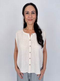 Astrid Button Down Blouse in brick with notch neckline, wooden button front, pintuck detail, and relaxed cap sleeves