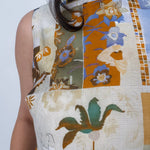 Jenny Lee Mixed Print Blouse in golden amber patchwork floral print with high round neckline and sleeveless silhouette