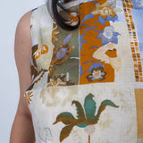 Jenny Lee Mixed Print Blouse in golden amber patchwork floral print with high round neckline and sleeveless silhouette