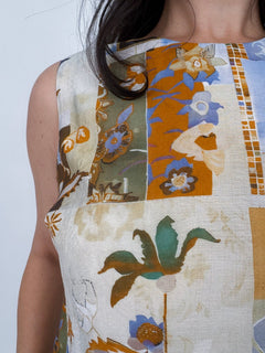 Jenny Lee Mixed Print Blouse in golden amber patchwork floral print with high round neckline and sleeveless silhouette