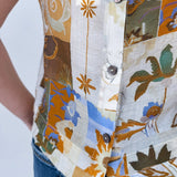 Jenny Lee Mixed Print Blouse in golden amber patchwork floral print with high round neckline and sleeveless silhouette